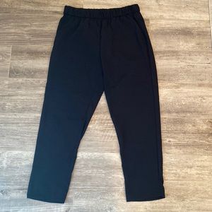 H&M black trousers with front pockets and elastic waist.  Size 8